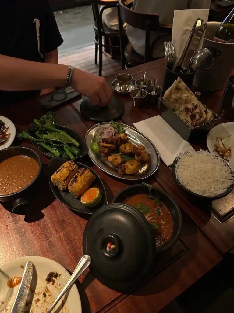A table full of food from Dishoom.