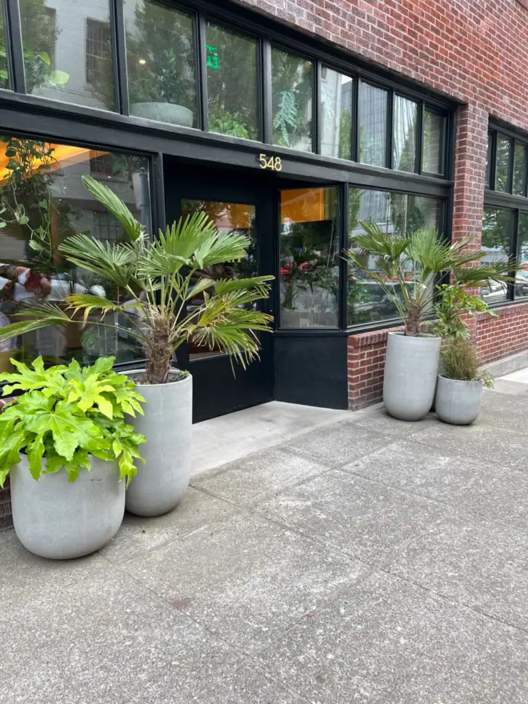 Kann from the front of its plant lined brick  buildings. 