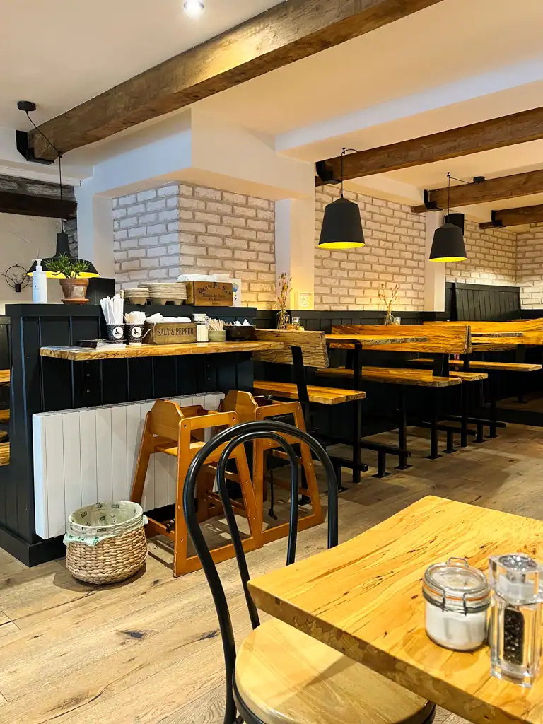 Casual and empty Irish cafe with tables and chairs.