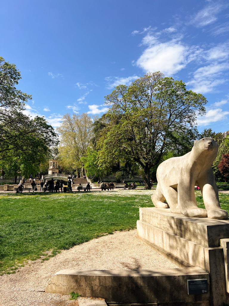 A polar bear statue in a green park in France, the first stop on Dijon's owl trail. 