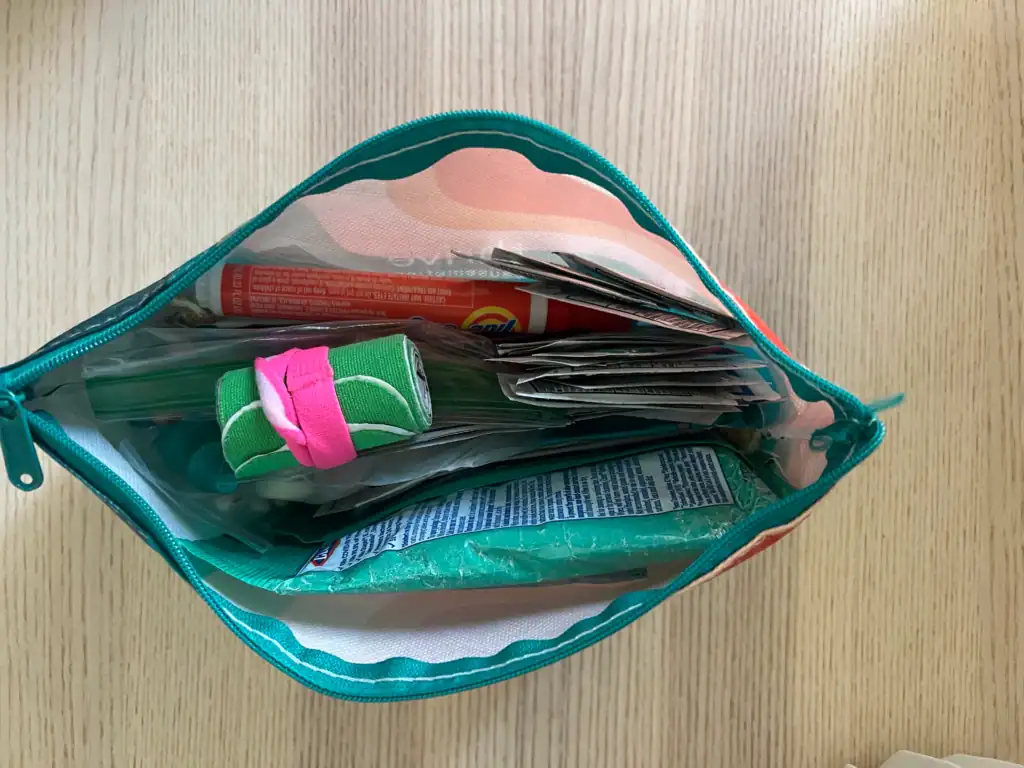 the open petite medical kit, showing meds and KT tape and clorox.