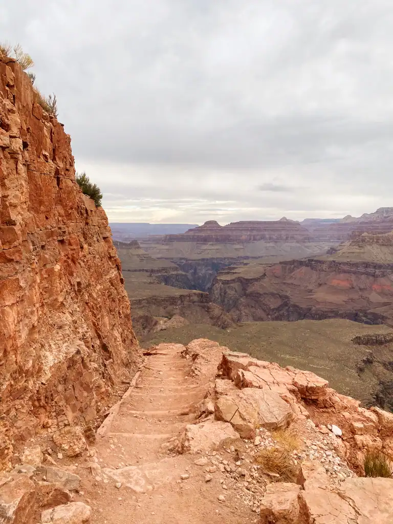 hiking down into the grand canyon on a southwest national park road trip. 