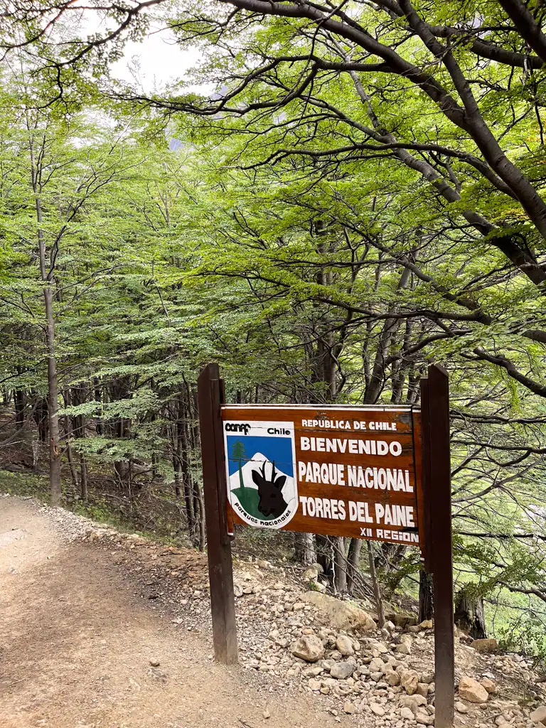 A sign welcoming to Torres del Paine on day 4 of the w trek near Chileno. 
