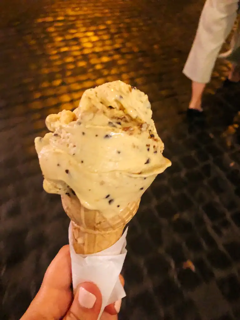 a cone of gelato at night. 
