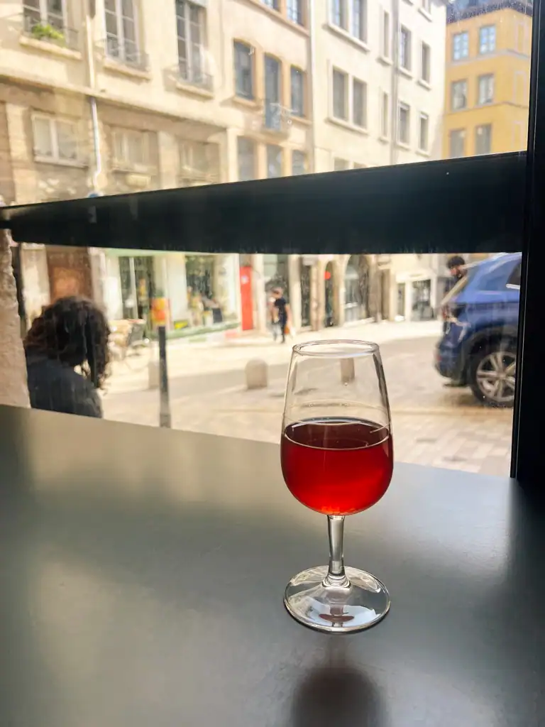 a glass of wine in Satriale one of the best bars in lyon. 