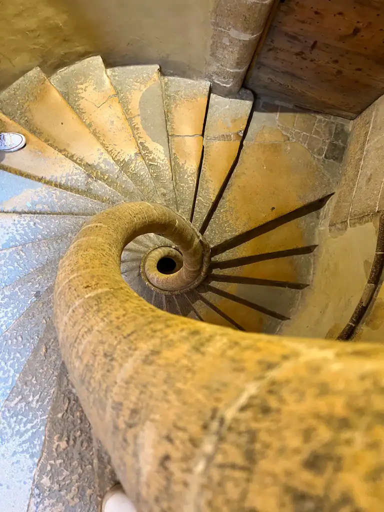 a tight spiral staircase in a traboule in Lyon. 