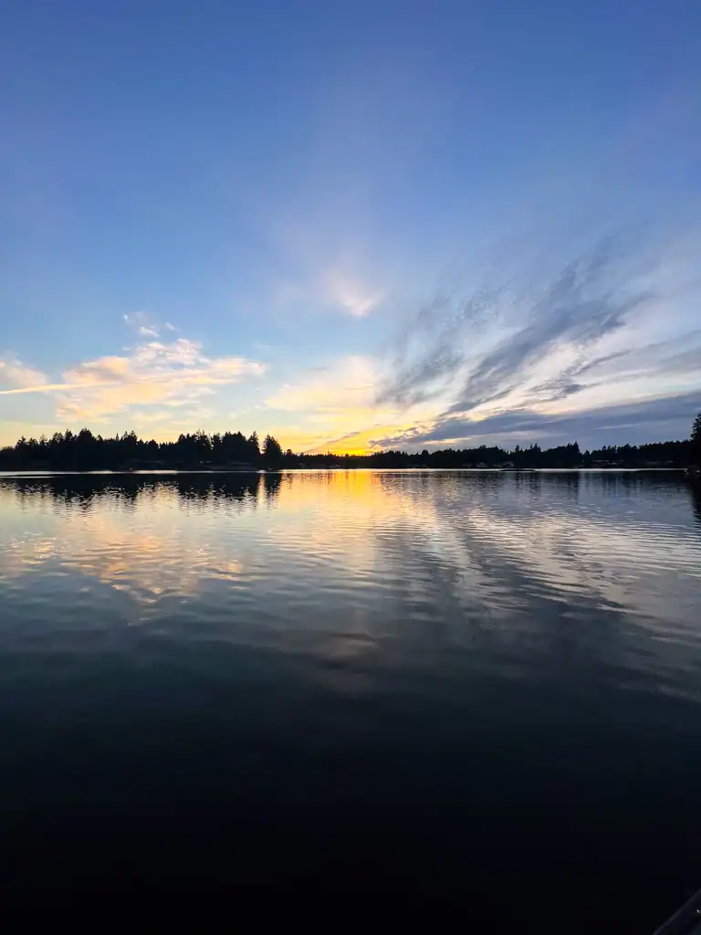 a sunset over a lake at ladies reading weekend. 