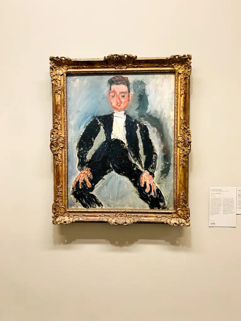 A charcoal art piece with a man in black suit at an odd angle. 