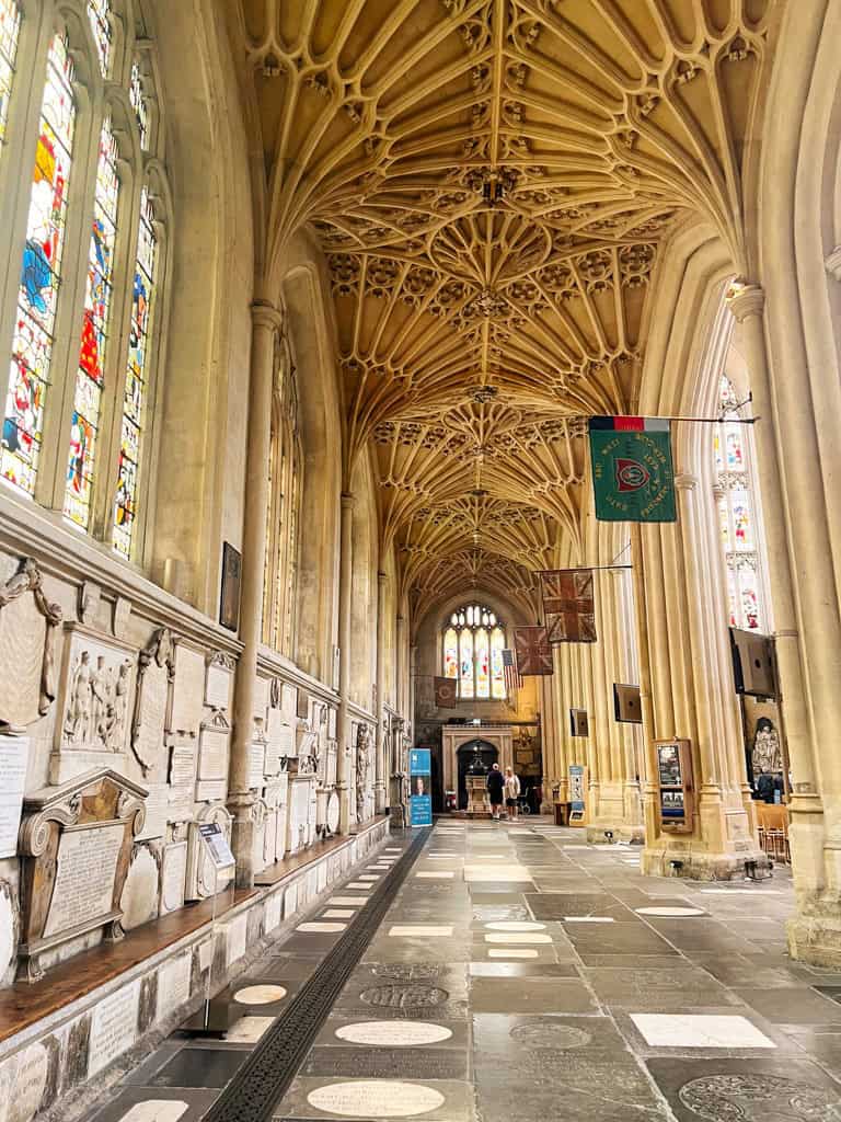 The interiors of teh bath abbey with its stone floor and intricate webbed celing on a weekend in Bath.