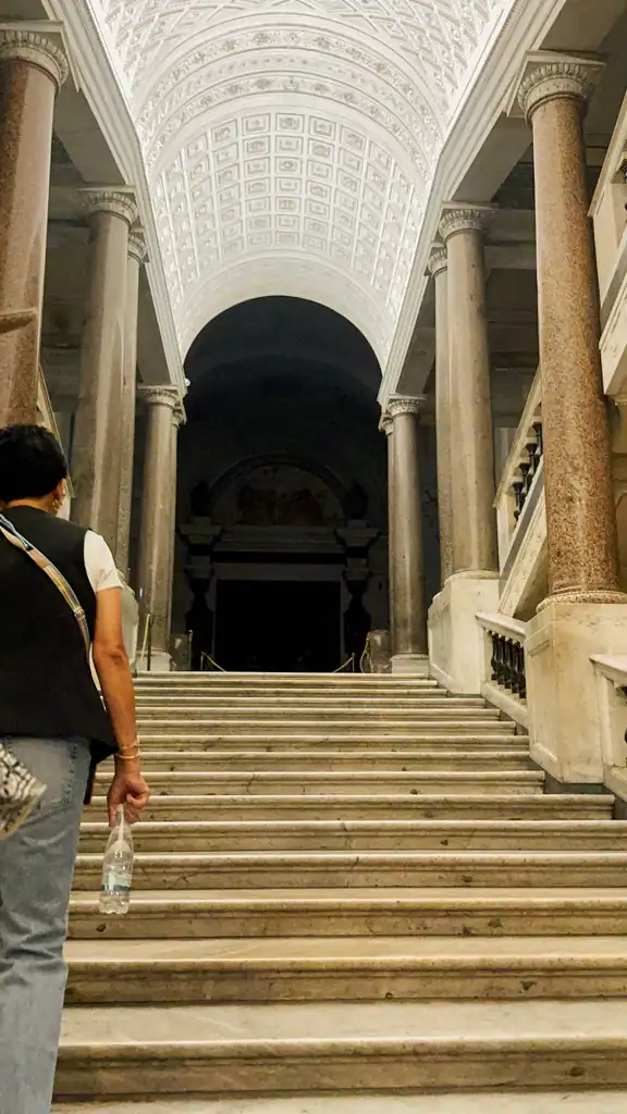 A staircase leading to a dark room in the Vatican Museum. 