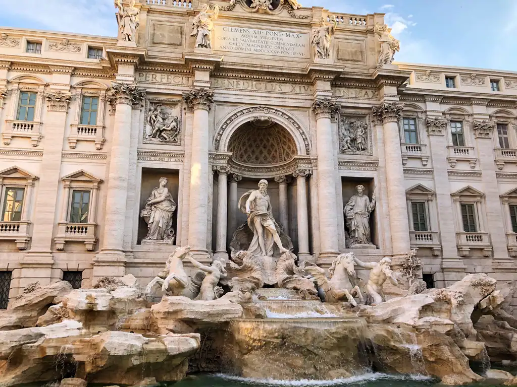 the trevi fountain during the day, in this rome travel guide.