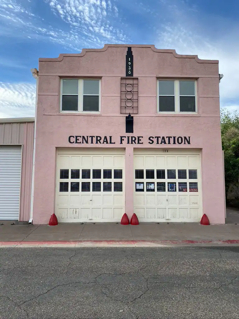 The central fire station that is a pink building in Marfa, Texas. 