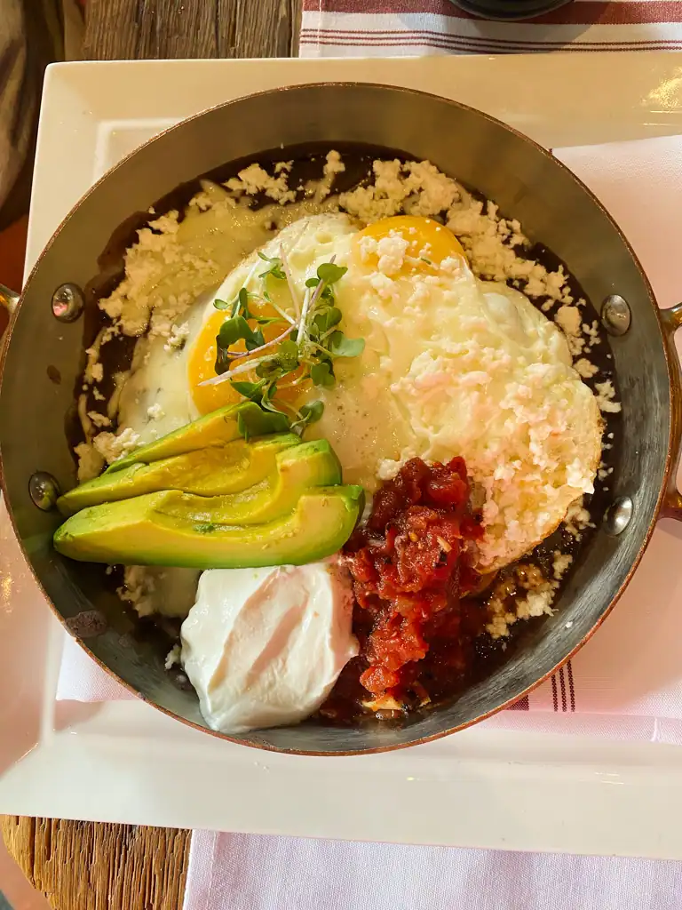A dish of eggs, avocado, salsa and sour cream at La bicyclette. 