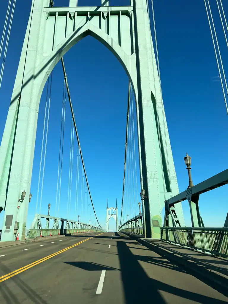 Up close of the green iron Cathedral bridge, one of the best things to do in Portland. 