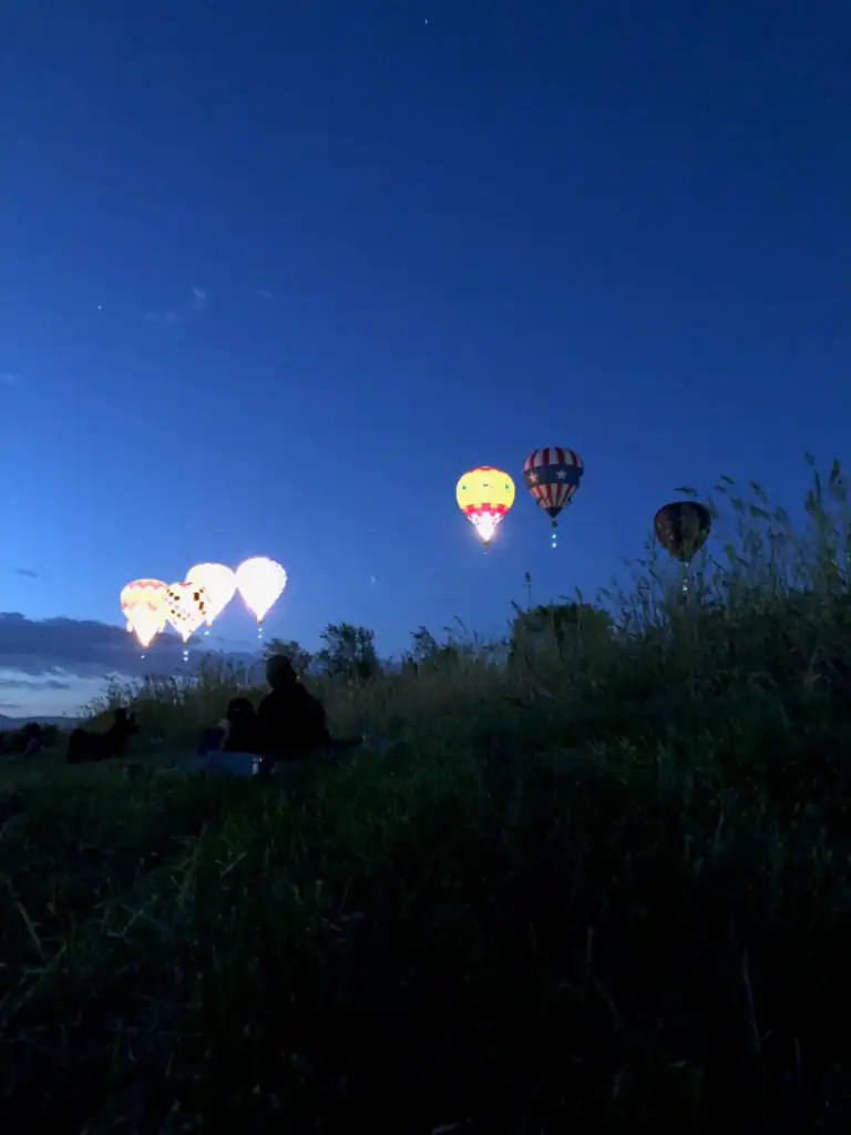 Glowing hot air balloons light up the dusky sky found in the best festivals around the world. 