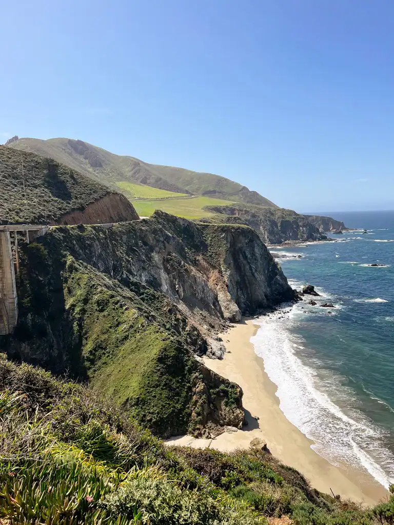 A view of the ocean and green mountains this big sur guide. 