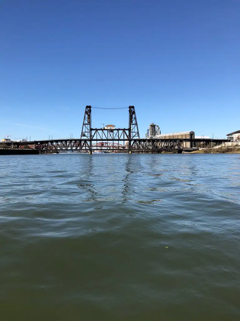 A view overlooking water of the steel bridge in Portland. 