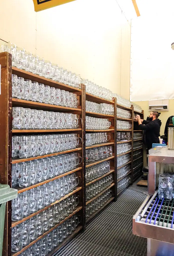 Shelves of steins at oktoberfest found in the best festivals around the world. 