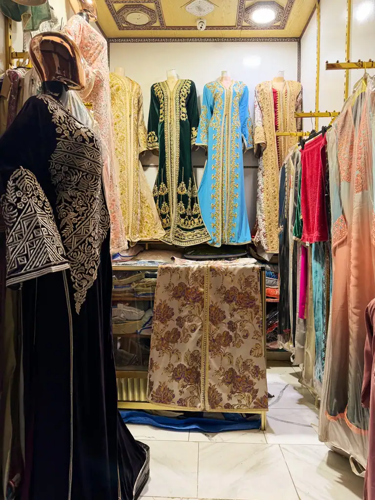 traditional moroccan wedding dresses in blue, red and black with gold detailing.