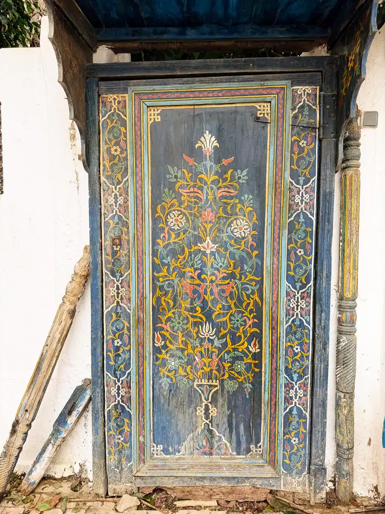Centuries old, hand paited blue door with floral design in the Kasbah in rabat, found on this morocco travel guide.