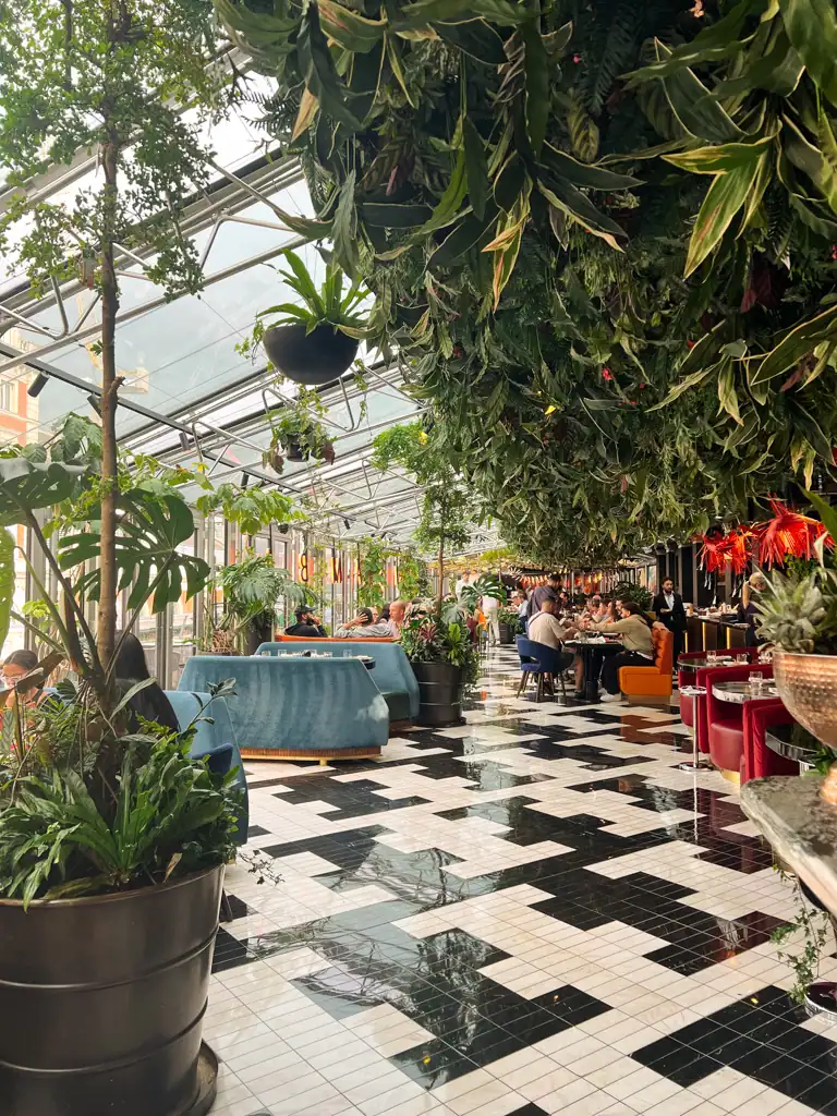 the inside of a restaurant in Covent Garden, recommended in the london guide, it is covered in plants. 
