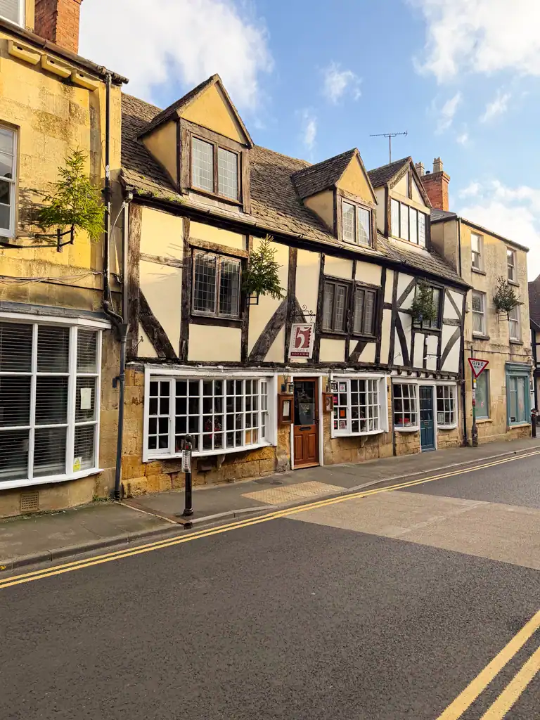 timbered buildings on a street in the cotswolds. 