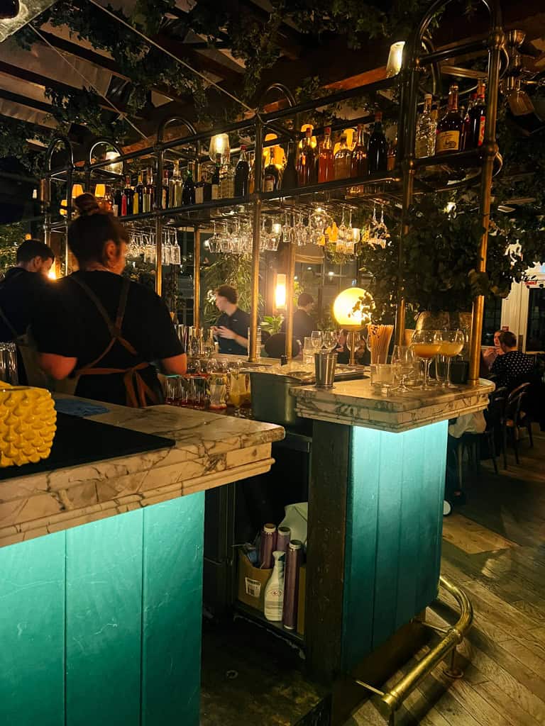 the bar on the top floor of pink mamma in paris.