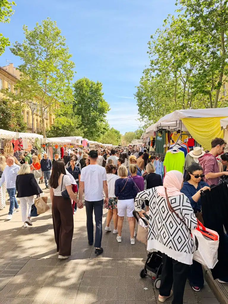 a busy market street in the weekend in aix-en-provence. 